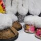 space-themed infant slippers in various sizes.