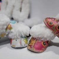 Soft and warm sheepskin slippers for babies.