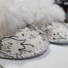 Cute sheepskin slippers for babies with heart designs.