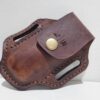 Leather paddle pouch for Leatherman tools with snap closure.